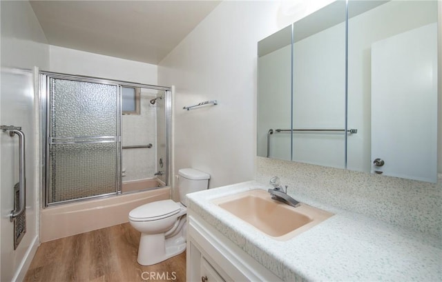 25070 Tulip Ave, Loma Linda, CA 92354 - bathroom with wood finished floors, vanity, and shower / bath combination with glass door