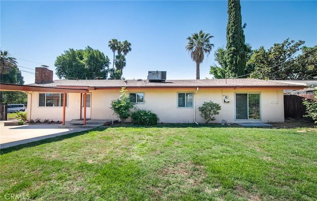 25070 Tulip Ave, Loma Linda, CA 92354 - ranch-style house with stucco siding, a chimney, and a patio