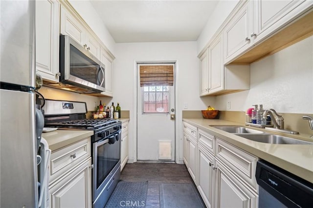 1748 S Mountain Ave Unit A, Ontario, CA 91762 - kitchen featuring appliances with stainless steel finishes, light countertops, white cabinets, and dark wood-type flooring