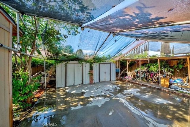 1493 W Grand Ave, Pomona, CA 91766 - fenced backyard with a storage shed and a patio