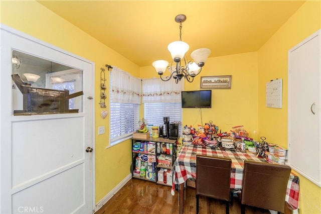1493 W Grand Ave, Pomona, CA 91766 - dining space with a chandelier and wood finished floors