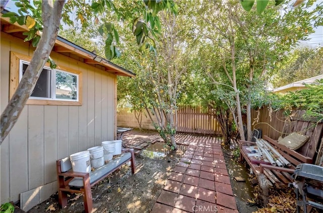 1493 W Grand Ave, Pomona, CA 91766 - fenced backyard featuring a patio area