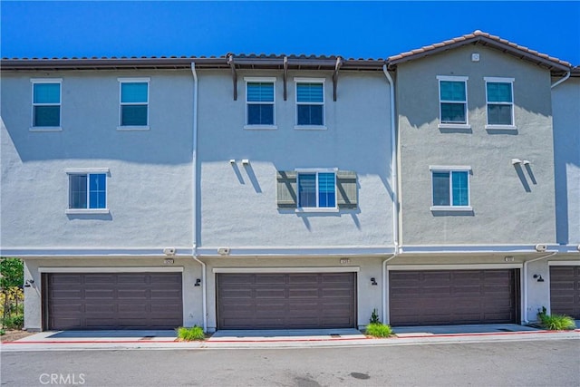 1239 Bonnet Way, Torrance, CA 90502 - view of front of property with an attached garage and stucco siding