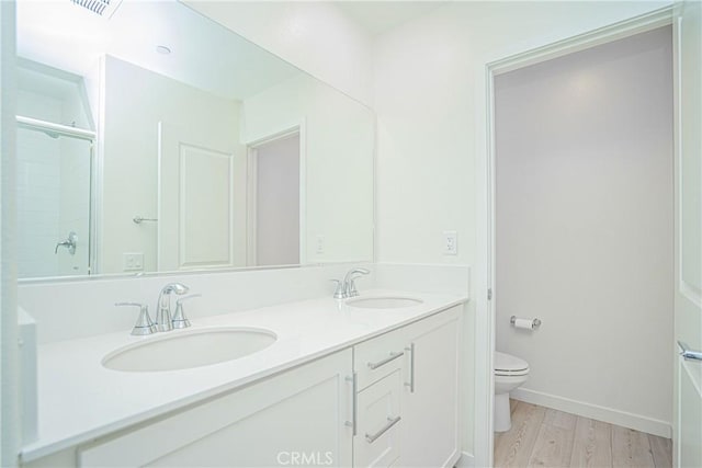 1239 Bonnet Way, Torrance, CA 90502 - bathroom with double vanity, a shower, and wood finished floors