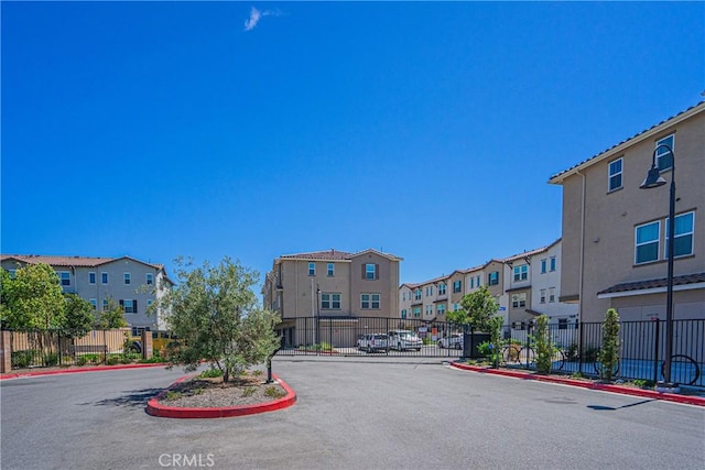 1239 Bonnet Way, Torrance, CA 90502 - view of asphalt street featuring a residential view, curbs, and a gated entry