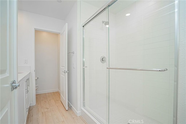 1239 Bonnet Way, Torrance, CA 90502 - bathroom featuring wood finished floors, a shower stall, and vanity
