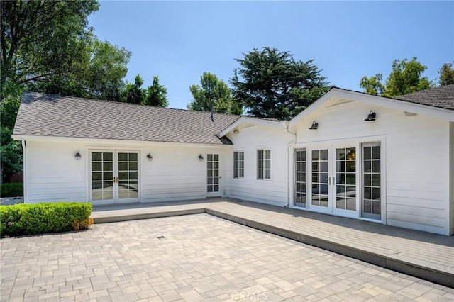17437 Chase St, Northridge, CA 91325 - back of house featuring french doors, a wooden deck, a patio area, and roof with shingles