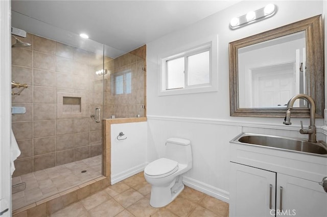 17437 Chase St, Northridge, CA 91325 - bathroom with a shower stall, tile patterned flooring, vanity, and a wainscoted wall