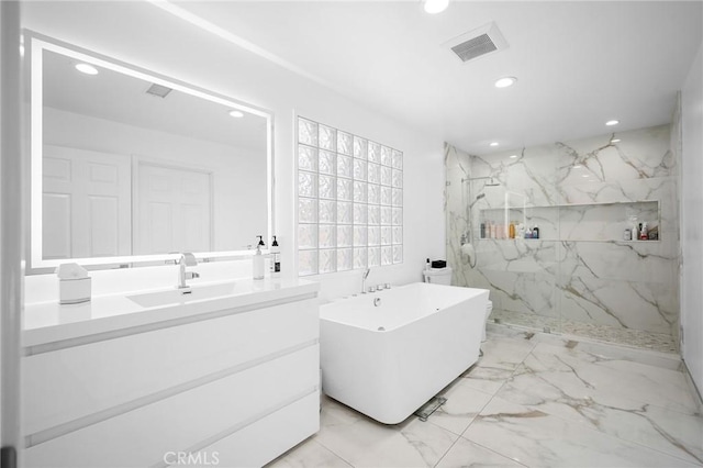 17437 Chase St, Northridge, CA 91325 - bathroom with recessed lighting, a marble finish shower, a freestanding bath, vanity, and marble finish flooring