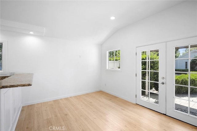 17437 Chase St, Northridge, CA 91325 - unfurnished dining area featuring vaulted ceiling, healthy amount of natural light, light wood finished floors, recessed lighting, and french doors