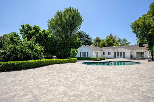 17437 Chase St, Northridge, CA 91325 - outdoor pool with french doors and a patio
