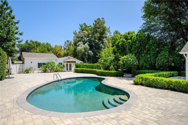 17437 Chase St, Northridge, CA 91325 - swimming pool with french doors, a patio area, and view of scattered trees