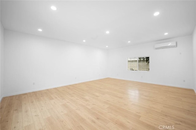 17437 Chase St, Northridge, CA 91325 - unfurnished room with a wall mounted air conditioner, light wood-style flooring, and recessed lighting