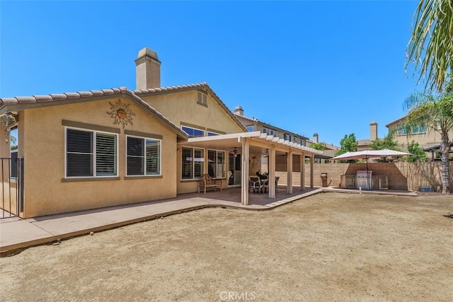 31676 Brentworth St, Menifee, CA 92584 - rear view of property with a chimney, stucco siding, a patio, and a pergola