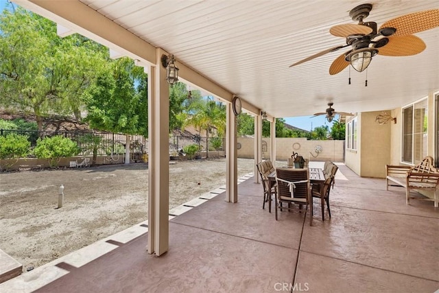 31676 Brentworth St, Menifee, CA 92584 - fenced backyard with outdoor dining area, ceiling fan, and a patio