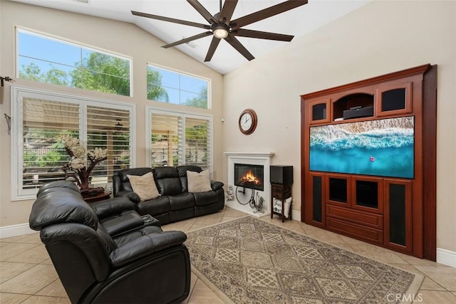 31676 Brentworth St, Menifee, CA 92584 - living room with light tile patterned floors, ceiling fan, a glass covered fireplace, and high vaulted ceiling