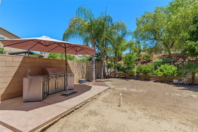 31676 Brentworth St, Menifee, CA 92584 - fenced backyard featuring area for grilling and a patio area