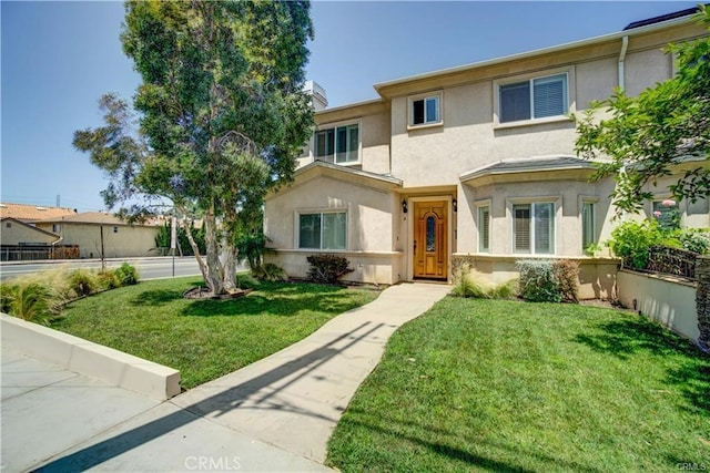 16714 Inglewood Ave Unit A, Lawndale, CA 90260 - view of front of house featuring stucco siding and a front yard