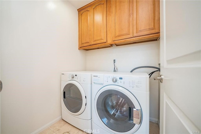 16714 Inglewood Ave Unit A, Lawndale, CA 90260 - washroom with cabinet space, separate washer and dryer, and light tile patterned floors