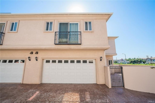 16714 Inglewood Ave Unit A, Lawndale, CA 90260 - view of front of property with a garage, stucco siding, a gate, and driveway