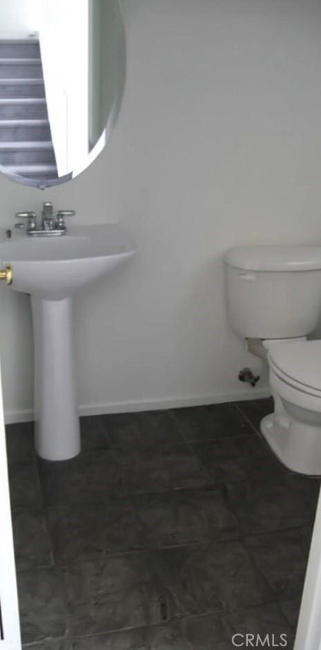 2237 Pajaro St, Oxnard, CA 93030 - half bath featuring toilet and baseboards