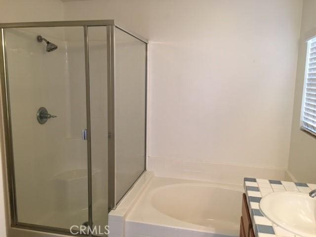 2237 Pajaro St, Oxnard, CA 93030 - bathroom featuring a shower stall, a garden tub, and vanity
