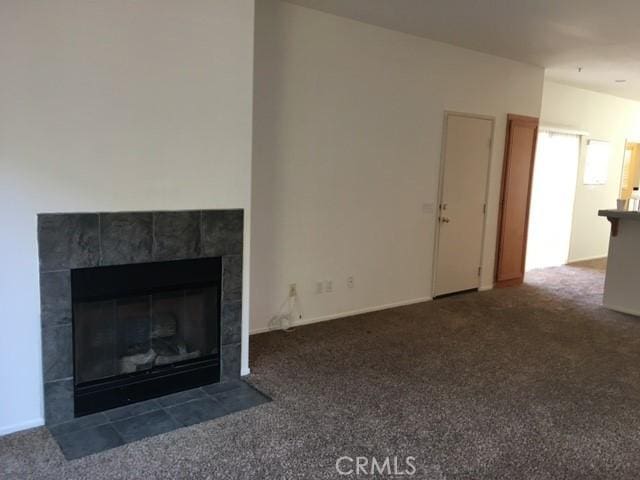 2237 Pajaro St, Oxnard, CA 93030 - unfurnished living room featuring carpet flooring and a fireplace