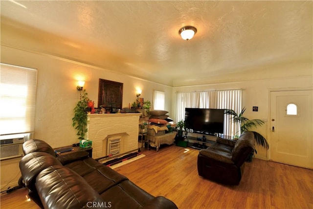 3945 Woolwine Dr, Los Angeles, CA 90063 - living area with a fireplace with raised hearth and wood finished floors
