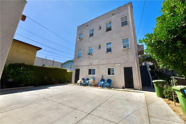3945 Woolwine Dr, Los Angeles, CA 90063 - rear view of property with stucco siding and a patio area
