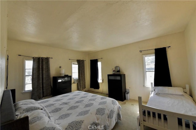 3945 Woolwine Dr, Los Angeles, CA 90063 - bedroom featuring light colored carpet and multiple windows