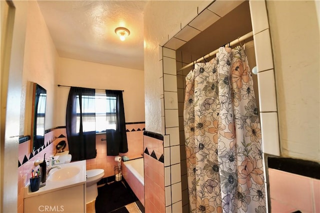 3945 Woolwine Dr, Los Angeles, CA 90063 - full bathroom featuring vanity, a garden tub, tile walls, and a shower with curtain
