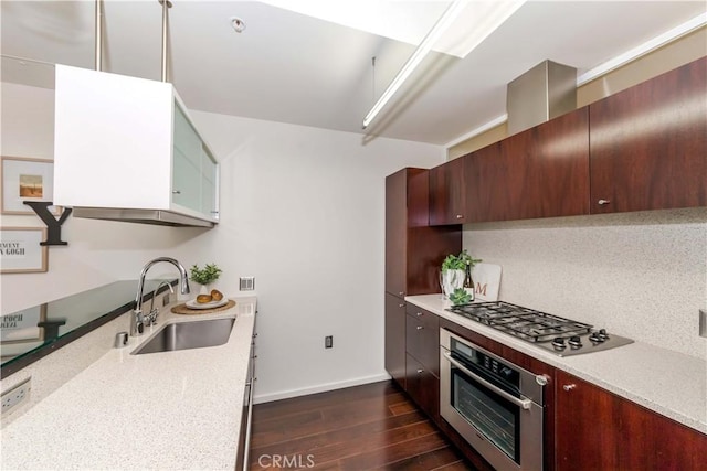 1155 S Grand Ave Unit 1008, Los Angeles, CA 90015 - kitchen featuring appliances with stainless steel finishes, dark wood finished floors, and modern cabinets