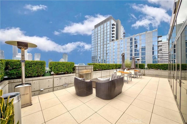 1155 S Grand Ave Unit 1008, Los Angeles, CA 90015 - view of patio with a city view and an outdoor hangout area