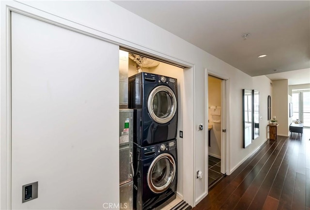 1155 S Grand Ave Unit 1008, Los Angeles, CA 90015 - laundry room featuring stacked washing machine and dryer and dark wood-style floors