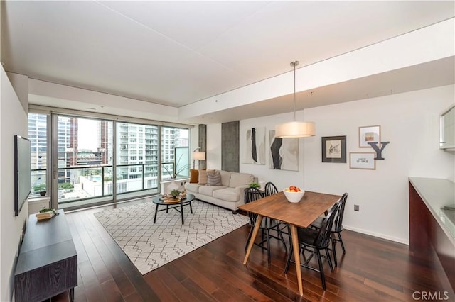 1155 S Grand Ave Unit 1008, Los Angeles, CA 90015 - dining room with plenty of natural light and dark wood finished floors