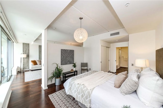 1155 S Grand Ave Unit 1008, Los Angeles, CA 90015 - bedroom with dark wood-type flooring and baseboards