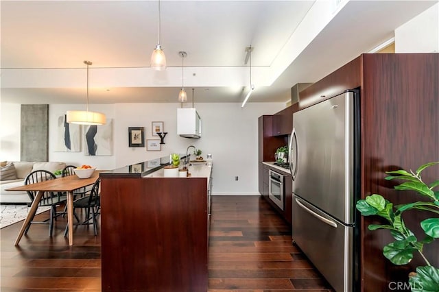 1155 S Grand Ave Unit 1008, Los Angeles, CA 90015 - kitchen with appliances with stainless steel finishes, dark wood finished floors, pendant lighting, and open floor plan