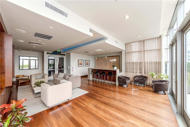 1155 S Grand Ave Unit 1008, Los Angeles, CA 90015 - living room with light wood finished floors, french doors, and recessed lighting
