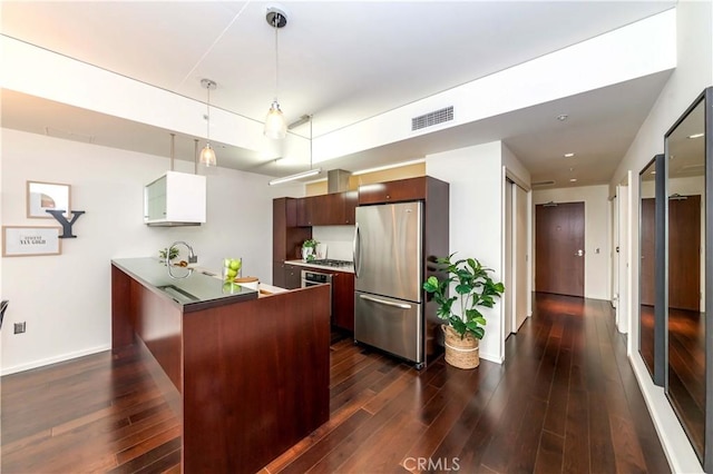 1155 S Grand Ave Unit 1008, Los Angeles, CA 90015 - kitchen with freestanding refrigerator, dark wood-style floors, a peninsula, hanging light fixtures, and modern cabinets