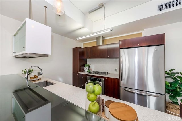 1155 S Grand Ave Unit 1008, Los Angeles, CA 90015 - kitchen featuring stainless steel appliances, light countertops, and decorative backsplash