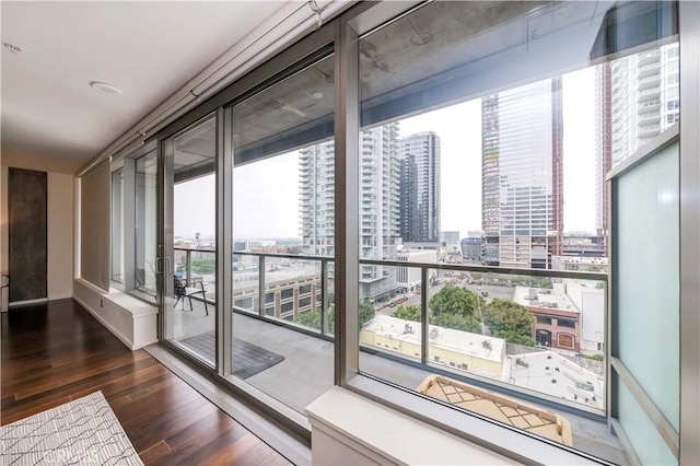 1155 S Grand Ave Unit 1008, Los Angeles, CA 90015 - interior space with a view of city, dark wood finished floors, and floor to ceiling windows