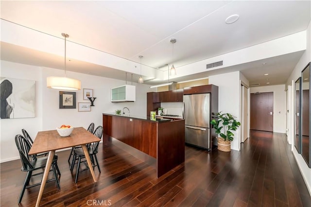 1155 S Grand Ave Unit 1008, Los Angeles, CA 90015 - dining room featuring dark wood-type flooring and baseboards