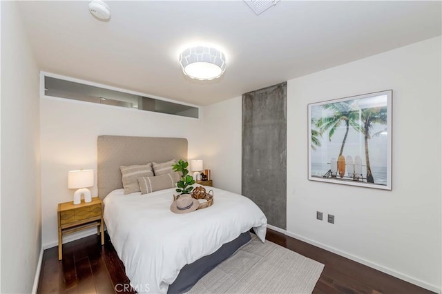 1155 S Grand Ave Unit 1008, Los Angeles, CA 90015 - bedroom featuring baseboards and wood finished floors