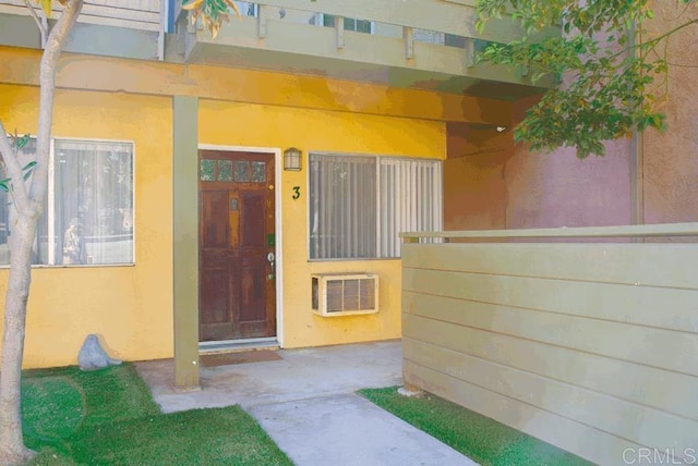 2041 E Grand Ave E Unit 3, Escondido, CA 92027 - entrance to property with an AC wall unit and stucco siding
