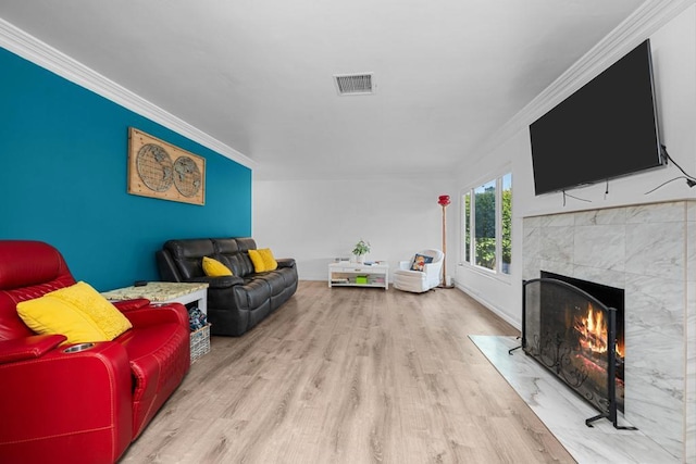 102 Sierra Way, Chula Vista, CA 91911 - living area featuring wood finished floors, crown molding, and a high end fireplace