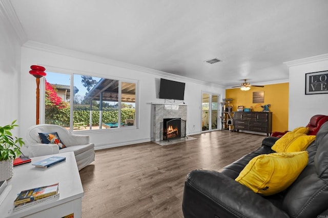 102 Sierra Way, Chula Vista, CA 91911 - living room featuring crown molding, wood finished floors, a premium fireplace, and a ceiling fan