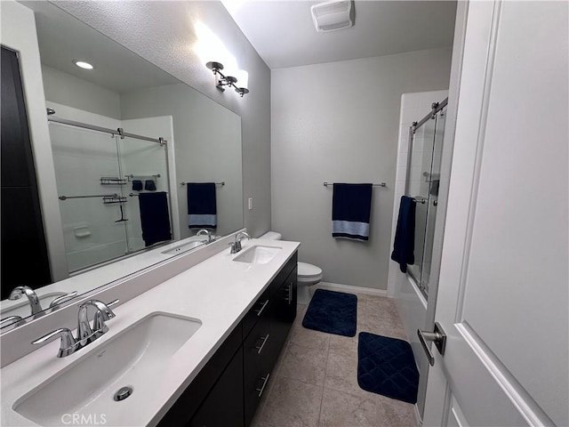 58 Origin, Irvine, CA 92618 - full bathroom featuring double vanity, tile patterned floors, and shower / bath combination with glass door