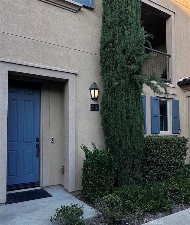 58 Origin, Irvine, CA 92618 - entrance to property featuring stucco siding