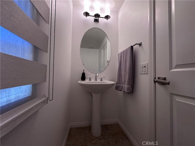 58 Origin, Irvine, CA 92618 - bathroom featuring baseboards and a sink