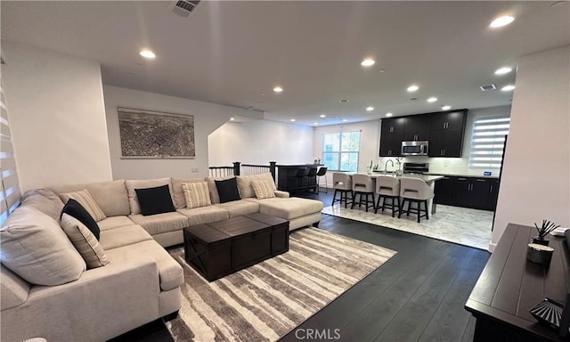 58 Origin, Irvine, CA 92618 - living room featuring dark wood finished floors and recessed lighting